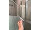 Modern tiled shower with a sleek glass door at 1940 E Citation Ln, Tempe, AZ 85284