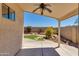 Covered patio overlooking the backyard with landscaped features and block fence for privacy at 19851 N 35Th St, Phoenix, AZ 85050