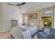 Cozy bedroom with natural light, a ceiling fan and comfortable armchair at 19851 N 35Th St, Phoenix, AZ 85050