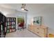 Comfortable bedroom features a desk and a chest of drawers for storage and style at 19851 N 35Th St, Phoenix, AZ 85050