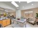 Bright kitchen features a large island, stainless steel appliances, and a sunlit sitting area at 19851 N 35Th St, Phoenix, AZ 85050