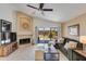 Inviting living room with a fireplace, comfortable seating, and sliding glass doors to outdoor space at 19851 N 35Th St, Phoenix, AZ 85050