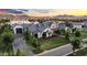 Expansive property featuring a large home with lush landscaping, a brick driveway, and mature trees at 20649 E Vallejo Ct, Queen Creek, AZ 85142