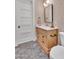 Charming bathroom with stylish vanity, patterned wallpaper, and elegant fixtures at 20649 E Vallejo Ct, Queen Creek, AZ 85142