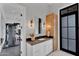 Bathroom with cabinet and view to gym at 20649 E Vallejo Ct, Queen Creek, AZ 85142