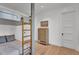 This bedroom features a custom bunk bed with a gold ladder and is adjacent to a classic wooden dresser at 20649 E Vallejo Ct, Queen Creek, AZ 85142
