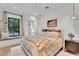 Cozy bedroom with a window seat, an ensuite bathroom, and neutral decor at 20649 E Vallejo Ct, Queen Creek, AZ 85142