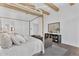 Bright bedroom with hardwood floors, four poster bed and accent furniture for a relaxing retreat at 20649 E Vallejo Ct, Queen Creek, AZ 85142