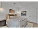 Comfortable bedroom with neutral decor, warm lighting, and stylish artwork at 20649 E Vallejo Ct, Queen Creek, AZ 85142