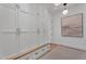 Spacious closet with custom built-in storage, drawers and modern lighting at 20649 E Vallejo Ct, Queen Creek, AZ 85142