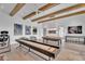 Large game room with shuffleboard table and pool table, perfect for entertaining at 20649 E Vallejo Ct, Queen Creek, AZ 85142