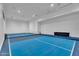 Spacious game room with pickleball court and comfortable sofa at 20649 E Vallejo Ct, Queen Creek, AZ 85142