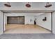 Spacious three-car garage with custom storage cabinets at 20649 E Vallejo Ct, Queen Creek, AZ 85142