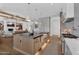 Gourmet kitchen with a large island, apron sink, stainless steel appliances, and breakfast bar seating at 20649 E Vallejo Ct, Queen Creek, AZ 85142
