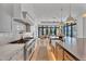 Gourmet kitchen featuring stainless steel appliances, custom cabinets, and a spacious island with seating at 20649 E Vallejo Ct, Queen Creek, AZ 85142
