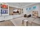 Entertainment room with built-in cabinetry, display shelves and comfortable seating at 20649 E Vallejo Ct, Queen Creek, AZ 85142