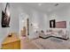 Inviting living room with comfortable sofa, stylish decor, and view into hallway at 20649 E Vallejo Ct, Queen Creek, AZ 85142