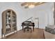 Chic music room with a grand piano, stylish cabinet, and modern decor at 20649 E Vallejo Ct, Queen Creek, AZ 85142
