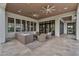 A comfortable outdoor seating area with wicker furniture provides ample space for relaxing and entertaining by the pool at 20649 E Vallejo Ct, Queen Creek, AZ 85142