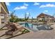 Inviting pool area with lounge chairs, a spa, and a pavilion in the background at 20649 E Vallejo Ct, Queen Creek, AZ 85142
