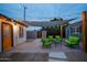 Charming backyard patio with cozy seating area and string lights, offering a relaxing outdoor space at 2227 N 16Th Ave, Phoenix, AZ 85007