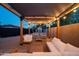 Backyard featuring stylish pergola with seating, string lights, privacy fence, and a storage shed at 2227 N 16Th Ave, Phoenix, AZ 85007