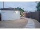 Backyard view with stone walkway, landscaping, and patio seating area, providing a serene outdoor retreat at 2227 N 16Th Ave, Phoenix, AZ 85007