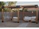 Backyard with a cozy pergola, complete with comfortable seating and ambient string lights at 2227 N 16Th Ave, Phoenix, AZ 85007
