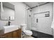 Modern bathroom featuring a glass enclosed shower with sleek black hardware and a stylish vanity with vessel sink at 2227 N 16Th Ave, Phoenix, AZ 85007