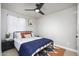 Bright bedroom featuring a comfortable bed, modern fan, and serene atmosphere for restful nights at 2227 N 16Th Ave, Phoenix, AZ 85007