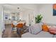Open floor plan showcasing dining area with modern table and chairs adjacent to the kitchen at 2227 N 16Th Ave, Phoenix, AZ 85007