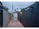 Exterior shot of landscaped pathway with block wall and home in the background at 2227 N 16Th Ave, Phoenix, AZ 85007