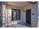 Inviting front porch with decorative tile flooring and black and white accents to the front door at 2227 N 16Th Ave, Phoenix, AZ 85007