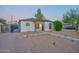 Charming painted brick home with desert landscaping and secure gated drive creates exceptional curb appeal at 2227 N 16Th Ave, Phoenix, AZ 85007
