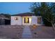 Charming bungalow featuring desert landscaping, lighted walkway, and a freshly painted exterior elevation at 2227 N 16Th Ave, Phoenix, AZ 85007