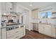 Well-equipped kitchen with stainless steel appliances, granite countertops, and dark wood flooring at 2227 N 16Th Ave, Phoenix, AZ 85007