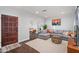 Inviting living room featuring a comfortable gray sectional sofa, area rug, and stylish decor at 2227 N 16Th Ave, Phoenix, AZ 85007