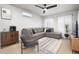 Cozy living room featuring stylish furniture, a modern ceiling fan, and lots of natural light at 2227 N 16Th Ave, Phoenix, AZ 85007