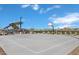Outdoor basketball court with seating area, perfect for recreational games and community activities at 22705 E Happy Rd, Queen Creek, AZ 85142