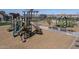 Community playground featuring multiple slides, climbing structures, and covered play areas for children at 22705 E Happy Rd, Queen Creek, AZ 85142