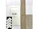 Close up of an interior design sample collection with tile, countertop, wood flooring, white cabinet, and carpet at 22705 E Happy Rd, Queen Creek, AZ 85142