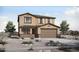 Charming two-story home featuring a two-car garage and desert landscaping, creating an inviting curb appeal at 23001 E Diana Way, Queen Creek, AZ 85142
