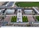 Aerial view of pickleball courts, cornhole game, and covered seating in a landscaped community at 23039 E Watford Dr, Queen Creek, AZ 85142