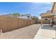This backyard features a gravel area with a wall offering privacy and string lights for ambiance at 2341 S Gordon --, Mesa, AZ 85209
