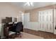 This bedroom features a modern workstation, ceiling fan, and natural light throughout the space at 2341 S Gordon --, Mesa, AZ 85209