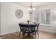 Charming dining area featuring hardwood floors and a modern chandelier at 2341 S Gordon --, Mesa, AZ 85209