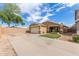 Well-maintained single-story house with a two-car garage and a green lawn at 2341 S Gordon --, Mesa, AZ 85209