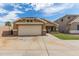 Charming single-story home featuring a two-car garage and well-manicured lawn at 2341 S Gordon --, Mesa, AZ 85209