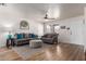 Cozy living room with hardwood floors, gray sofas, and a ceiling fan at 2341 S Gordon --, Mesa, AZ 85209