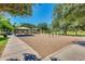 Community playground featuring swings, picnic tables, and climbing structures on a sunny day at 2341 S Gordon --, Mesa, AZ 85209